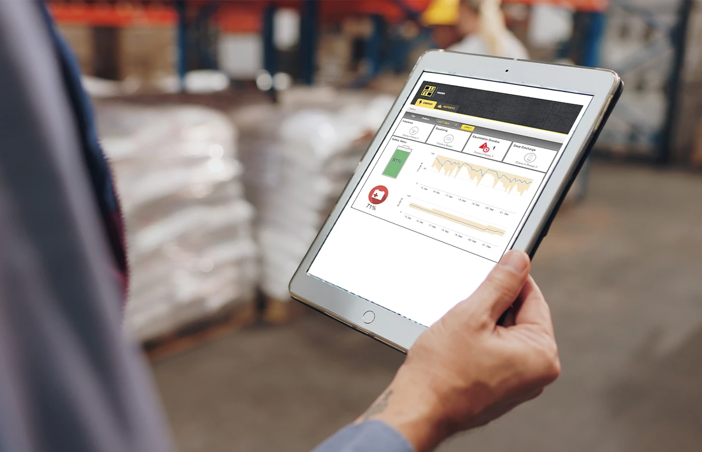 Hand holding a tablet which displays Speedshield Technology.